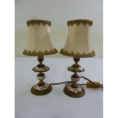 34 - A pair of porcelain and brass table lamps with silk shades