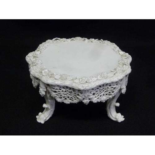 97 - A Meissen Blanc de Chine bocage stand, pierced sides on four scroll legs