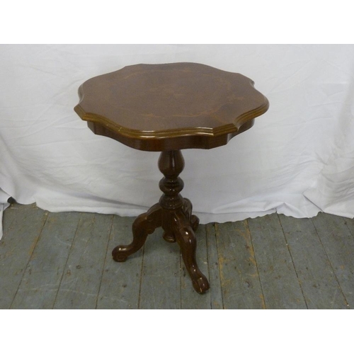 22 - A mahogany side table with shaped circular top on tripod base