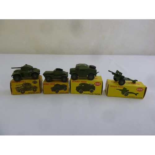 442 - Four Dinky Military vehicles Armoured Car 670, Scout Car 673, Field Tractor 688 and Field 25 Pound G... 