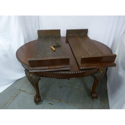 8 - A Victorian mahogany dining table shaped oval with two drop-in leaves and Joseph screw on four ball ... 