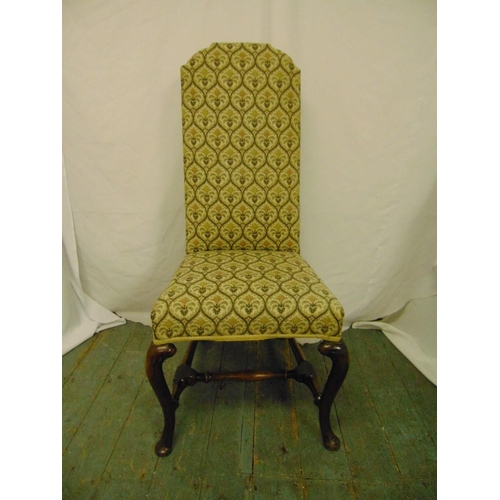 31 - A high back upholstered occasional chair on cabriole legs