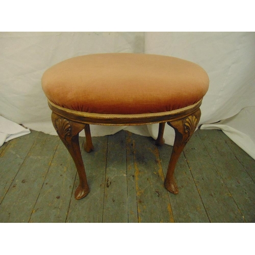 35 - A mahogany upholstered stool on four cabriole legs