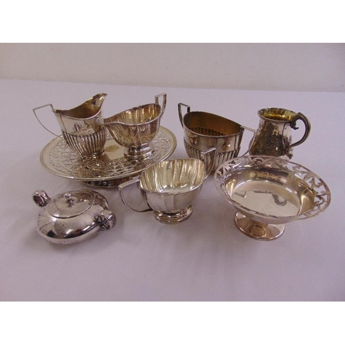 497 - A quantity of silver plate to include dishes, sugar bowls, milk jugs and a mug  (9)