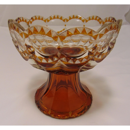 127 - A continental amber overlaid glass bowl on raised circular base, 21cm (h)