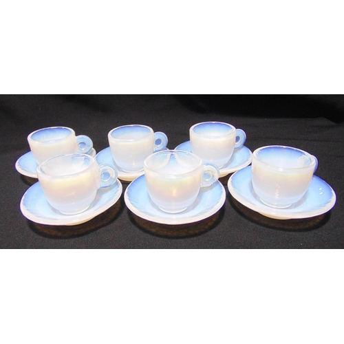 140 - A set of six Murano Effetre opalescent coffee cups and saucers