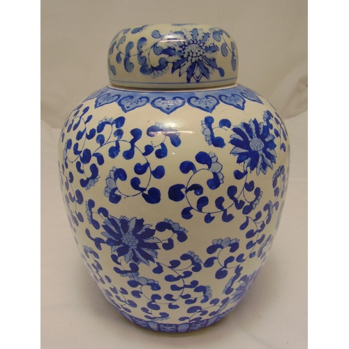 142 - A Chinese blue and white ginger jar and cover, ovoid form decorated with stylised flowers and leaves... 