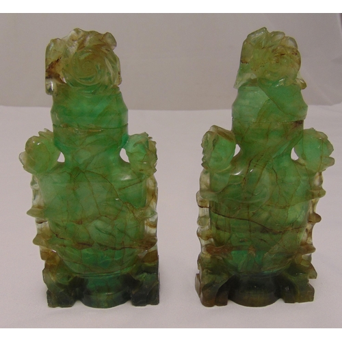 160 - A pair of oriental carved green quartz containers with floral pull off covers on shaped rectangular ... 