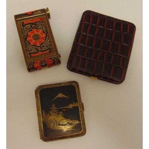 167 - A Japanese gilded metal cigarette case with an image of Mount Fuji, a Middle Eastern cigarette case ... 