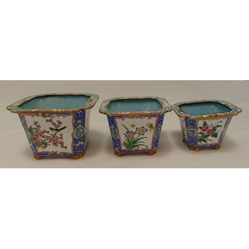 168 - A set of three graduated oriental metal and enamel plant holders decorated with flowers and leaves, ... 