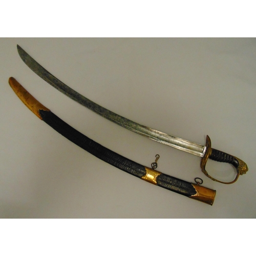 227 - An early 19th century military officer dress sword in brass and leather scabbard with engraved blade... 