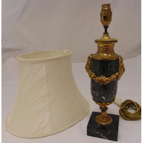 23 - A marble and gilt metal table lamp, oval with floral brass swags on raised square marble base to inc... 