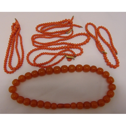 285 - Five coral bead necklaces and an amber bead necklace