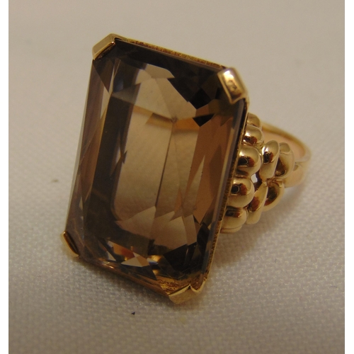 310 - 9ct yellow gold and smoky topaz dress ring, approx total weight 8.6g