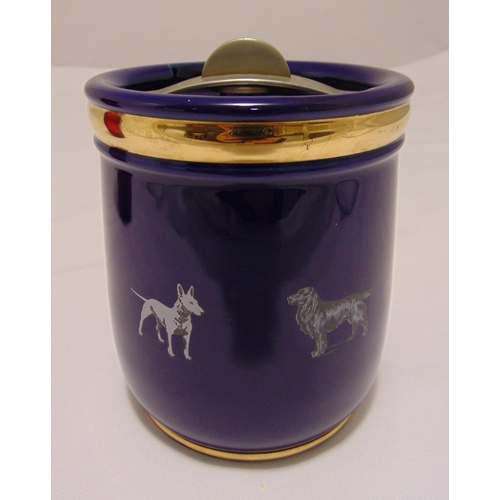 85 - Doulton blue ground tobacco jar and cover of cylindrical form with screw off cover, the sides decora... 