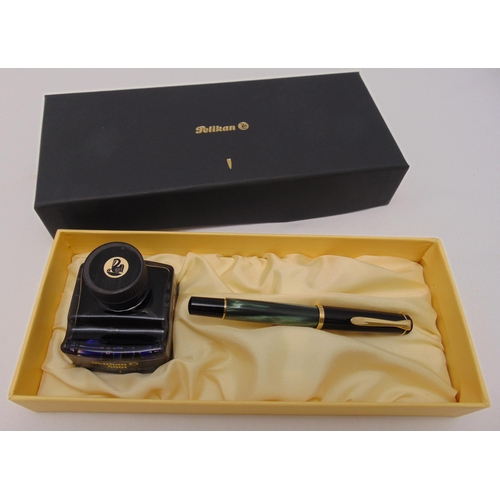 309 - Pelican fountain pen in original packaging to include a bottle of ink