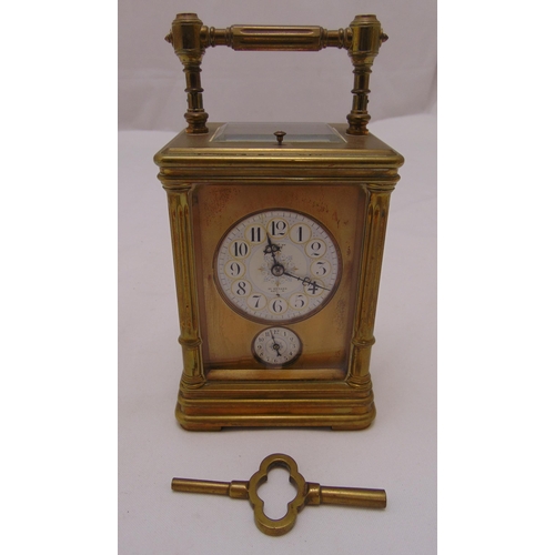 314 - A brass repeating carriage clock by Dent of the Strand, rectangular form with white enamel dial and ... 