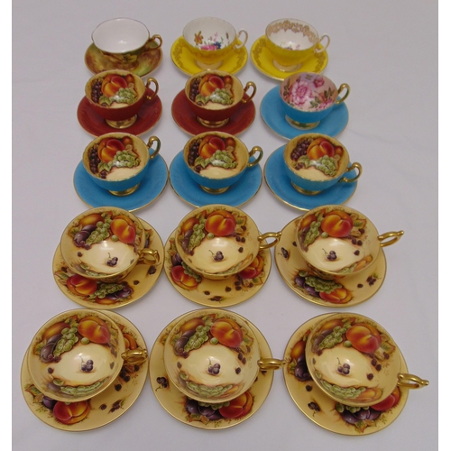A quantity of Aynsley tea cups and saucers to include fruit and floral