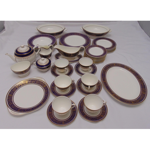 112 - Royal Doulton Imperial Blue part dinner service to include plates, bowls, oval platter, serving dish... 