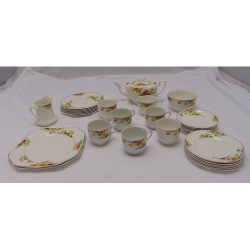 120 - Johnson Brothers Florida pattern teaset to include a teapot, a sugar bowl, a milk jug, plates, cups ... 