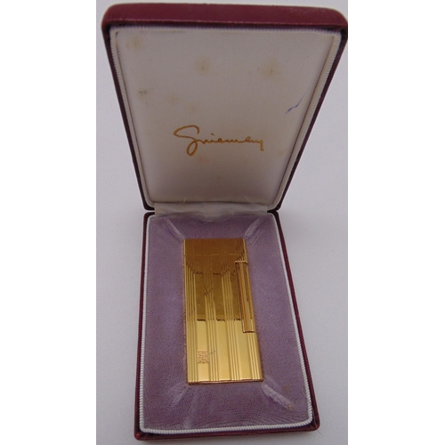 244 - Givenchy 2000 gilded cigarette lighter in original packaging