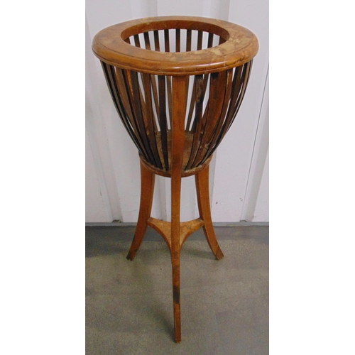 33 - An Edwardian mahogany plant stand of conical form, slatted sides on three outswept legs, 90 x 35cm