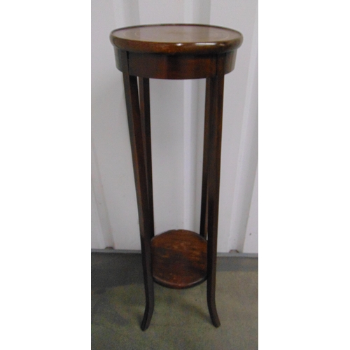 35 - A mahogany circular plant stand on four tapering rectangular supports, 99 x 29.5cm