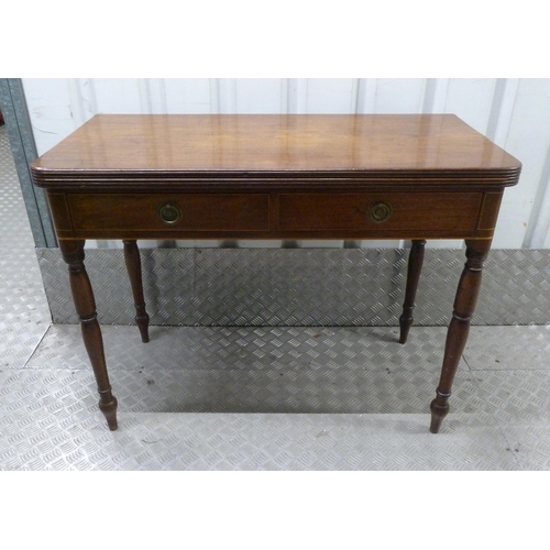 4 - A Regency rectangular mahogany tea table, two drawers with brass handles on turned cylindrical legs,... 