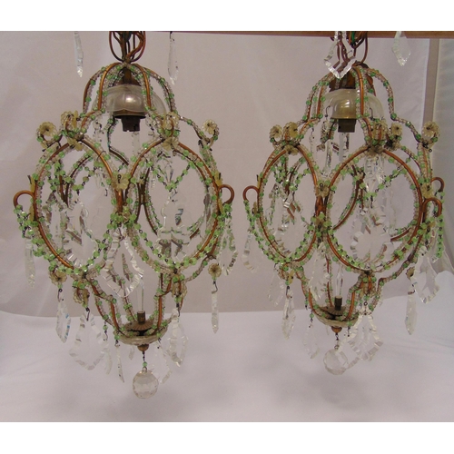 42 - A pair of Murano crystal and metal chandeliers of faceted oval form with faceted pendant drops, 75cm... 