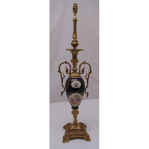 47 - A gilt metal and porcelain table lamp on raised square base with scroll feet, 89cm (h)