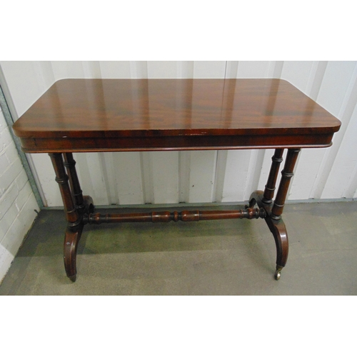 5 - A 19th century mahogany rectangular serving table, supported by four cylindrical columns on scroll l... 