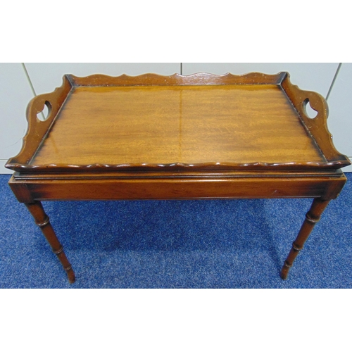 13 - A mahogany rectangular tea tray with pierced side handles on rectangular stand with tapering legs, 5... 