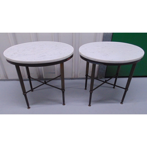 15 - A pair of oval marble top side tables on tapering cylindrical metal supports, 50.5 x 51.5 x 36.5cm e... 