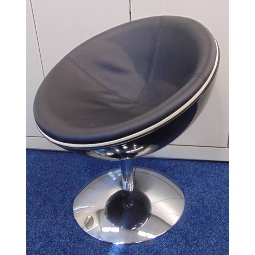 23 - A 1960s style conical revolving chair on raised circular base