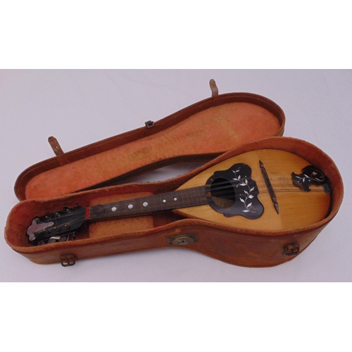 271 - An eight string Italian Mandolin in fitted leather case