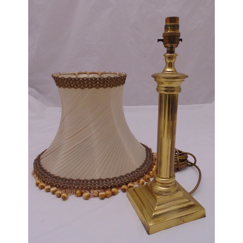 32 - A gilt metal columnular table lamp on stepped square base and silk shade, 39cm (h)