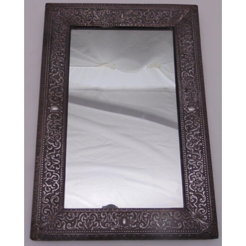 35 - A rectangular silver plated wall mirror with scroll chased beaded border, 53 x 36cm