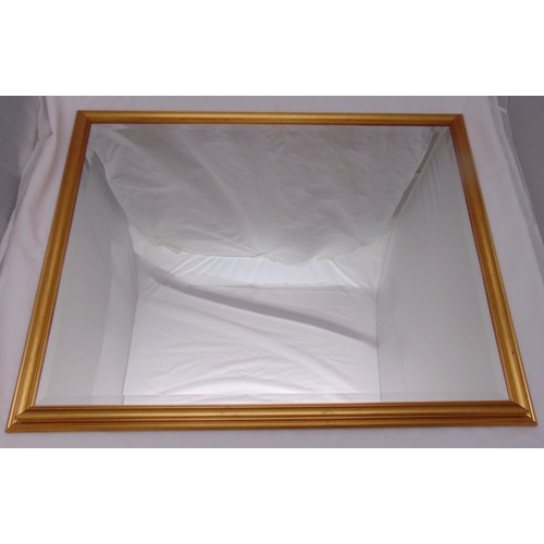 36 - A rectangular gilded wooden framed wall mirror, 84.5 x 110cm