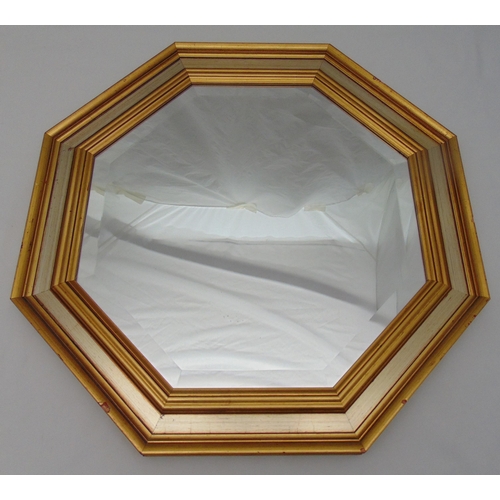 37 - An octagonal wall mirror with moulded gilded wooden frame, 63.5 x 63.5cm