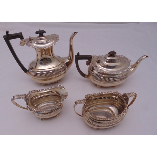 392 - A hallmarked silver four piece tea and coffee set, rounded rectangular with gadroon and shell border... 