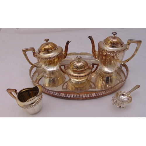 393 - A continental white metal tea and coffee set, oval panelled with fruiting borders, teapot and coffee... 