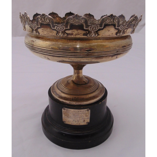 395 - A hallmarked silver trophy cup on raised circular base mounted on a wooden plinth with applied hallm... 