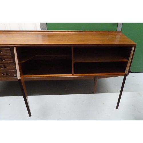 1 - A mid 20th century Rosewood rectangular sideboard with cupboards and four drawers with turned wooden... 