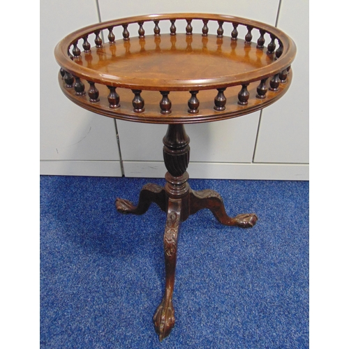 10 - A circular mahogany occasional table with pierced gallery on three carved outswept legs with ball an... 