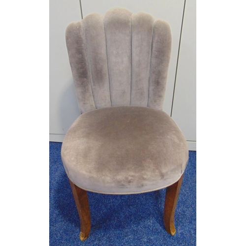 15 - An Art Deco upholstered chair with fluted back on four outswept legs