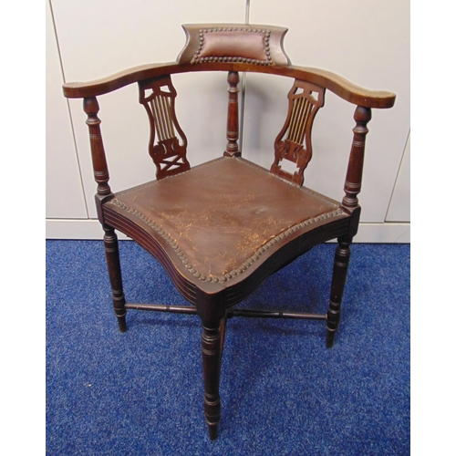 17 - An Edwardian mahogany inlaid corner chair on four turned legs with leather upholstered seat and back