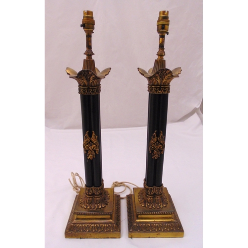 24 - A pair of gilt metal and bronzed table lamps, cluster column stems, leaf chased capitals, the raised... 