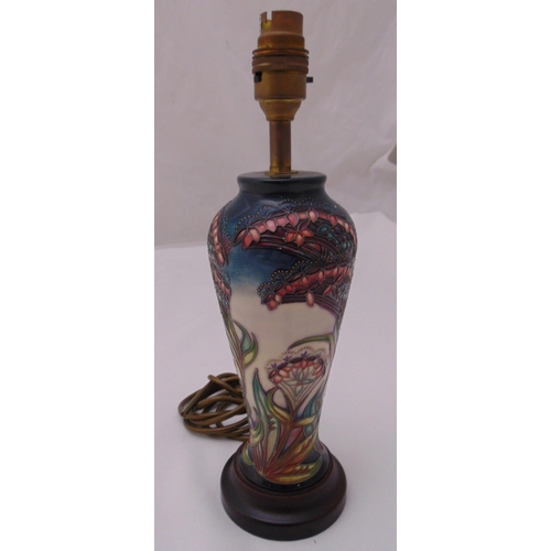 26 - A Moorcroft baluster vase converted to a table lamp decorated with flowers on raised hardwood base, ... 