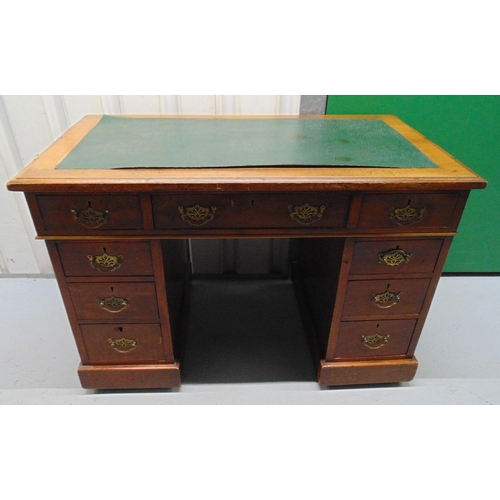 5 - An early 20th century rectangular mahogany pedestal desk with tooled leather top and brass swing  ha... 