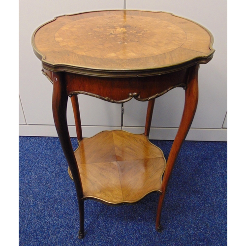 9 - A late Victorian shaped circular two tier side table with inlaid floral spray to the top on four cab... 